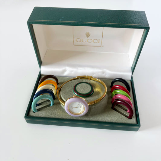 Gucci 1990s Interchangeable Bezel Gold Plated Bangle Watch with 12 bezels, case