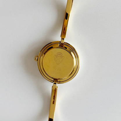 Gucci 1990s Interchangeable Bezel Gold Plated Bangle Watch with 12 bezels, case