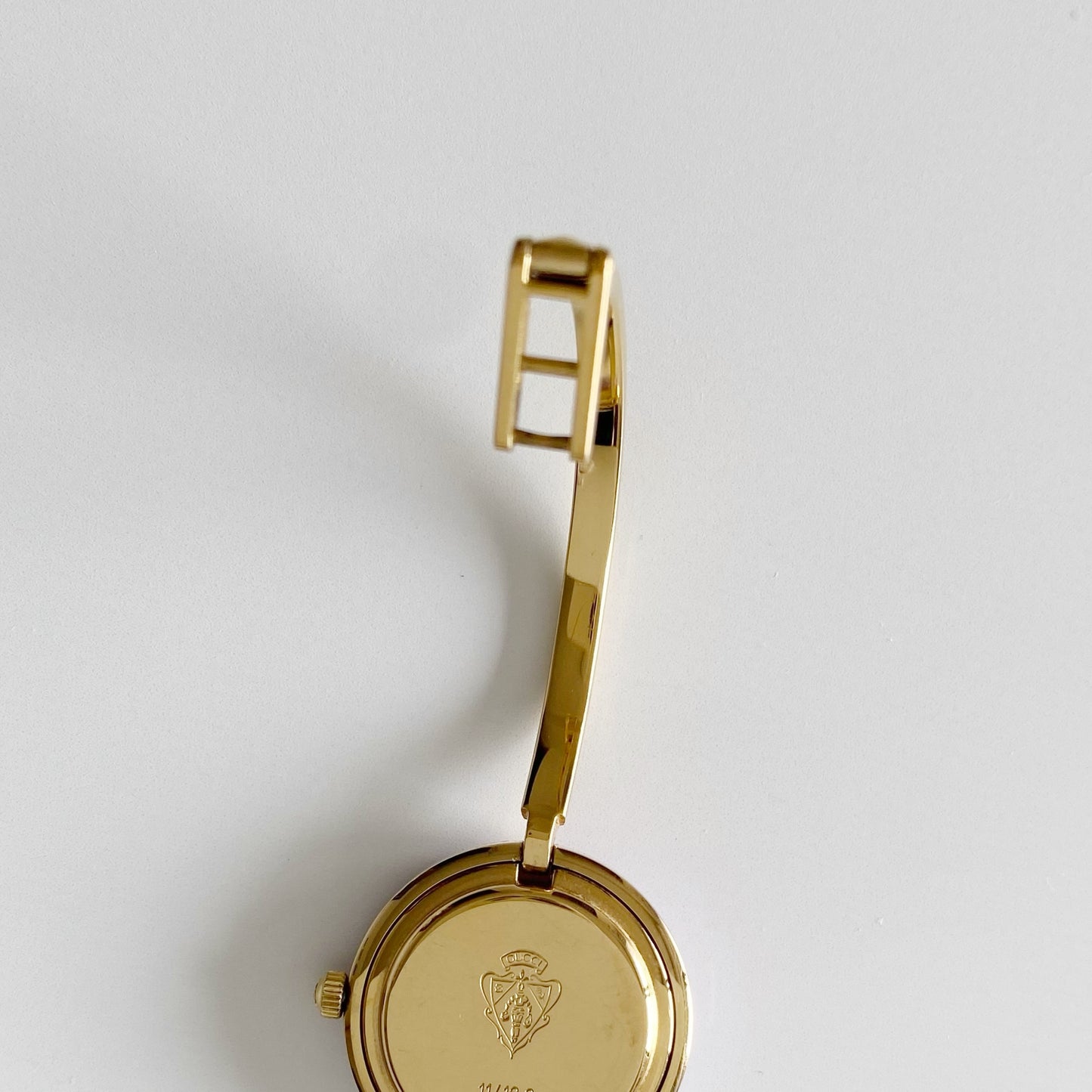 Gucci 1990s Interchangeable Bezel Gold Plated Bangle Watch with 12 bezels, case