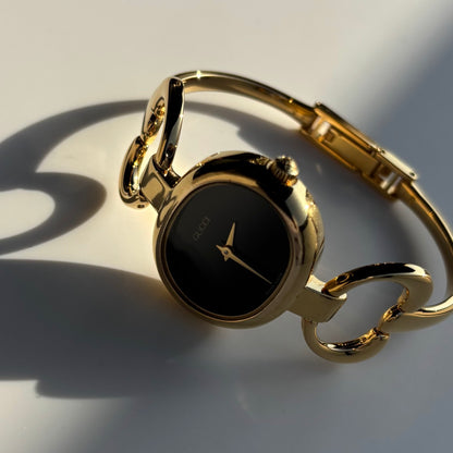 Gucci 1990s Oval Black Dial Gold Plated Bangle Watch (Small)