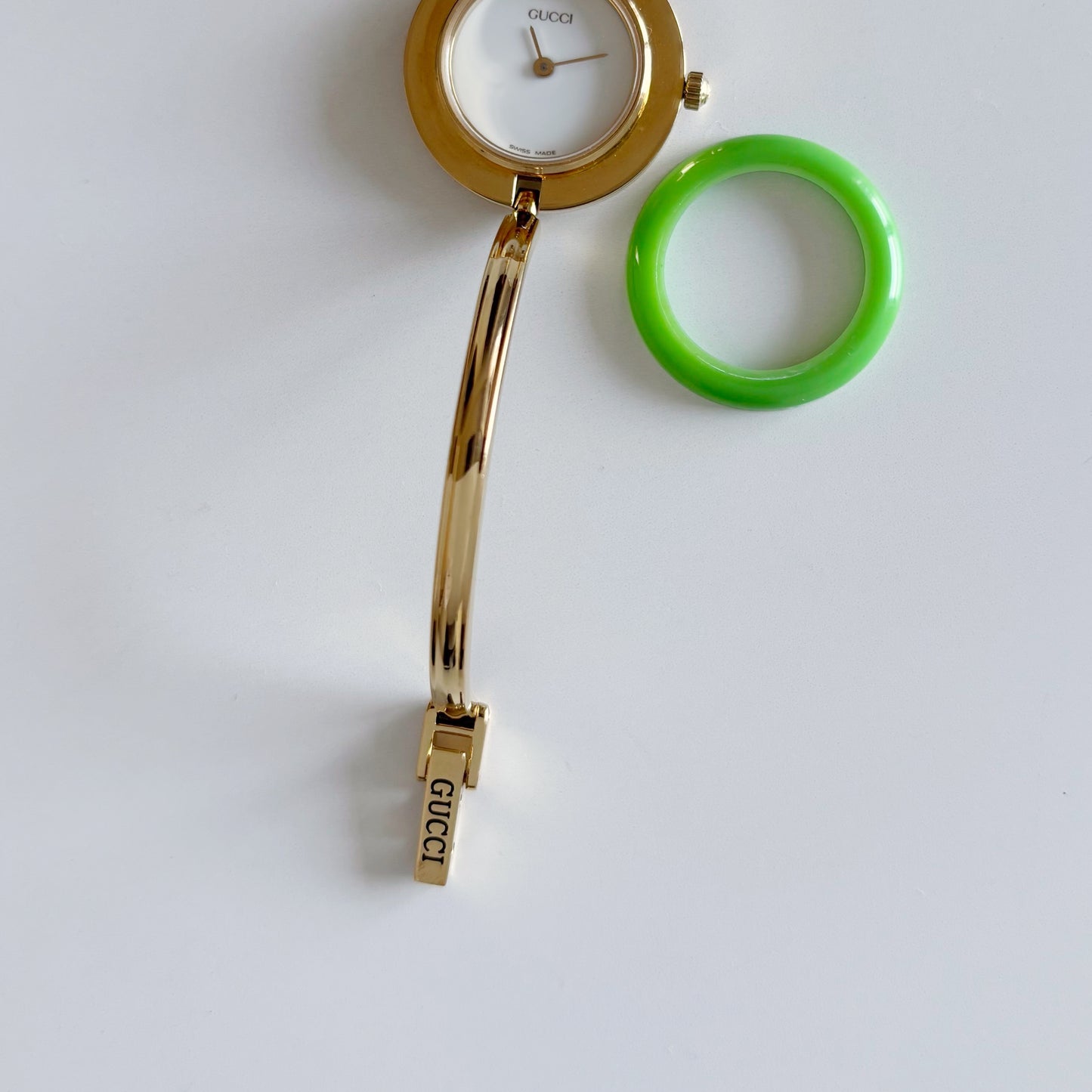 Gucci 1990s Interchangeable Bezel Gold Plated Bangle Watch with 12 bezels, case