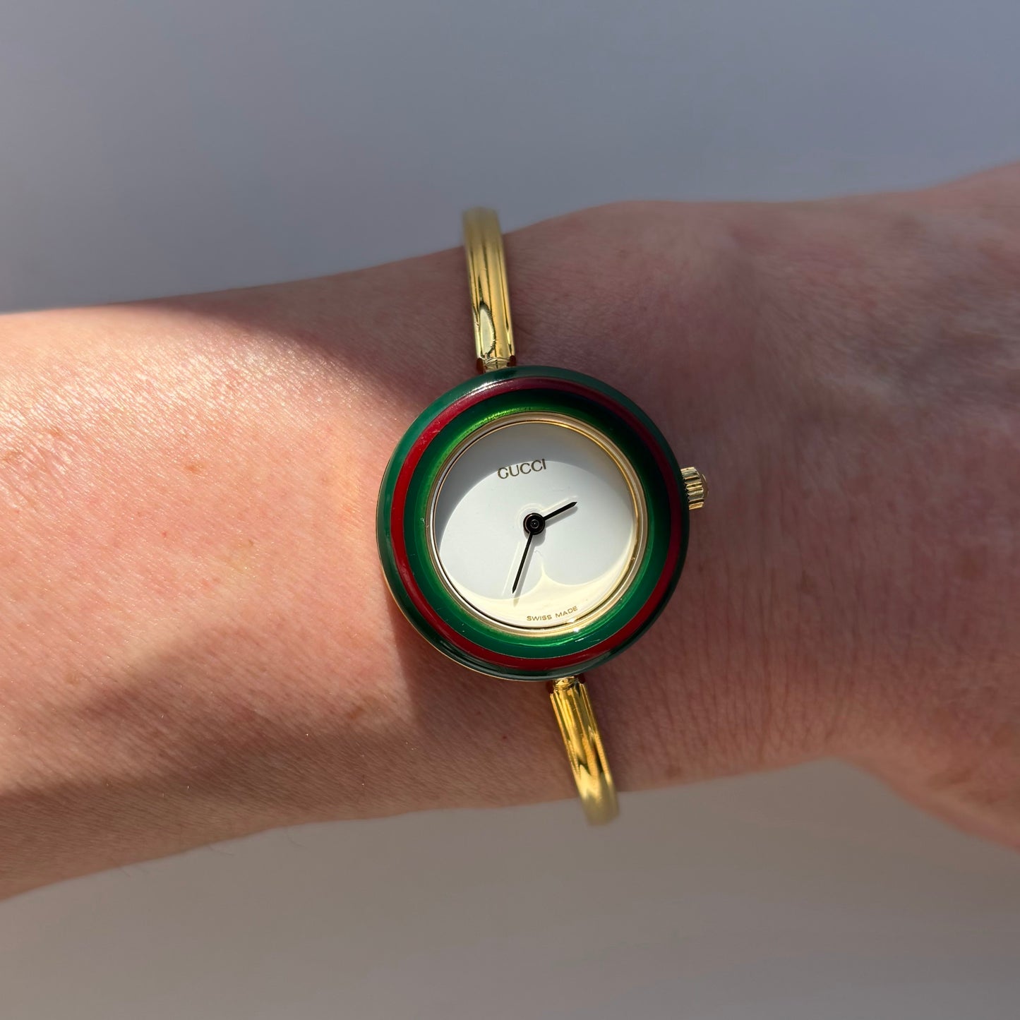 Gucci 1990s Interchangeable Bezel Gold Plated Bangle Watch with 12 bezels, case