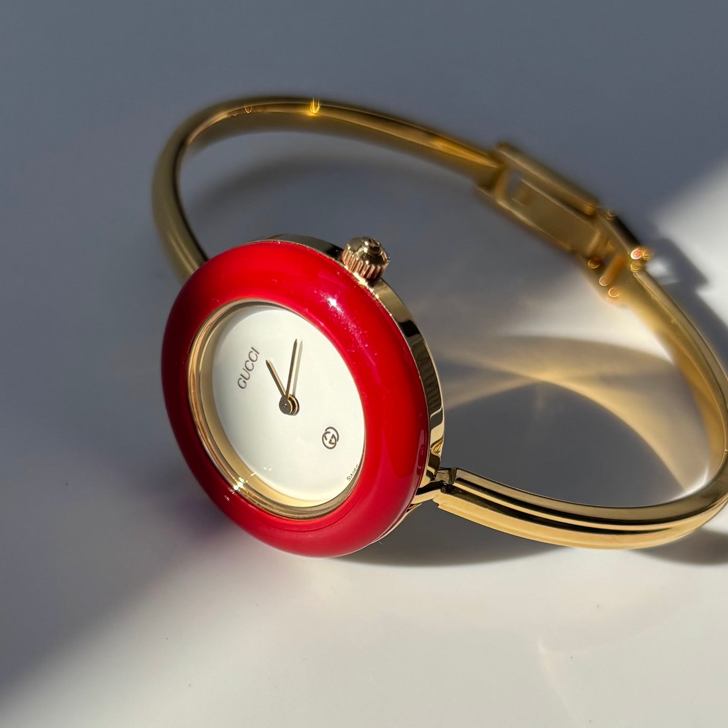 Gucci 1990s Interchangeable Bezel Gold Plated Bangle Watch with 12 bezels, case