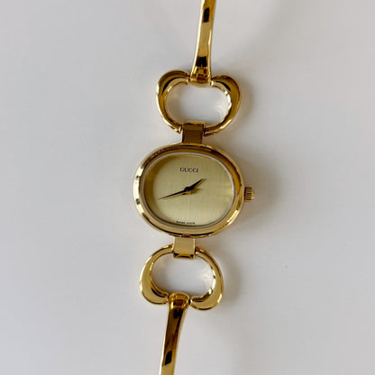 Gucci 1990s Oval Gold Dial Gold Plated Bangle Watch (Small)