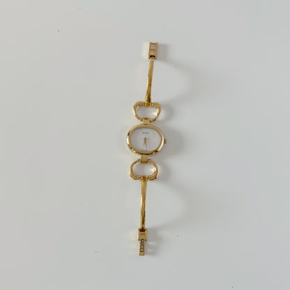 Gucci 1990s Seashell Oval Dial Gold-Plated Bangle Watch (Small)