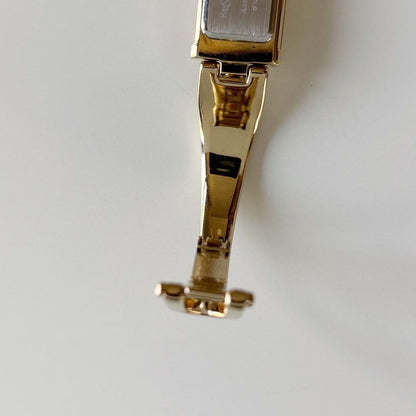 Yves Saint Laurent 1990s Peek a boo Gold Plated Bangle Watch