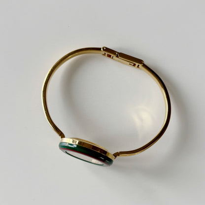 Gucci 1990s Interchangeable Bezel Gold Plated Bangle Watch with 12 bezels, case