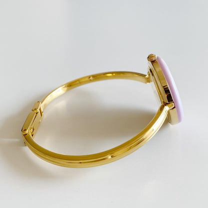 Gucci 1990s Interchangeable Bezel Gold Plated Bangle Watch with 12 bezels, case