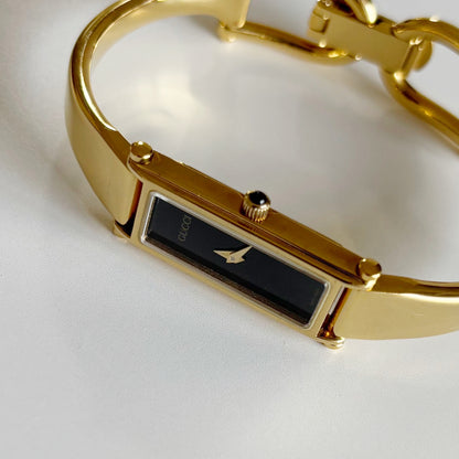 Gucci 1990s Black Dial Rectangular Gold Plated Bangle Watch