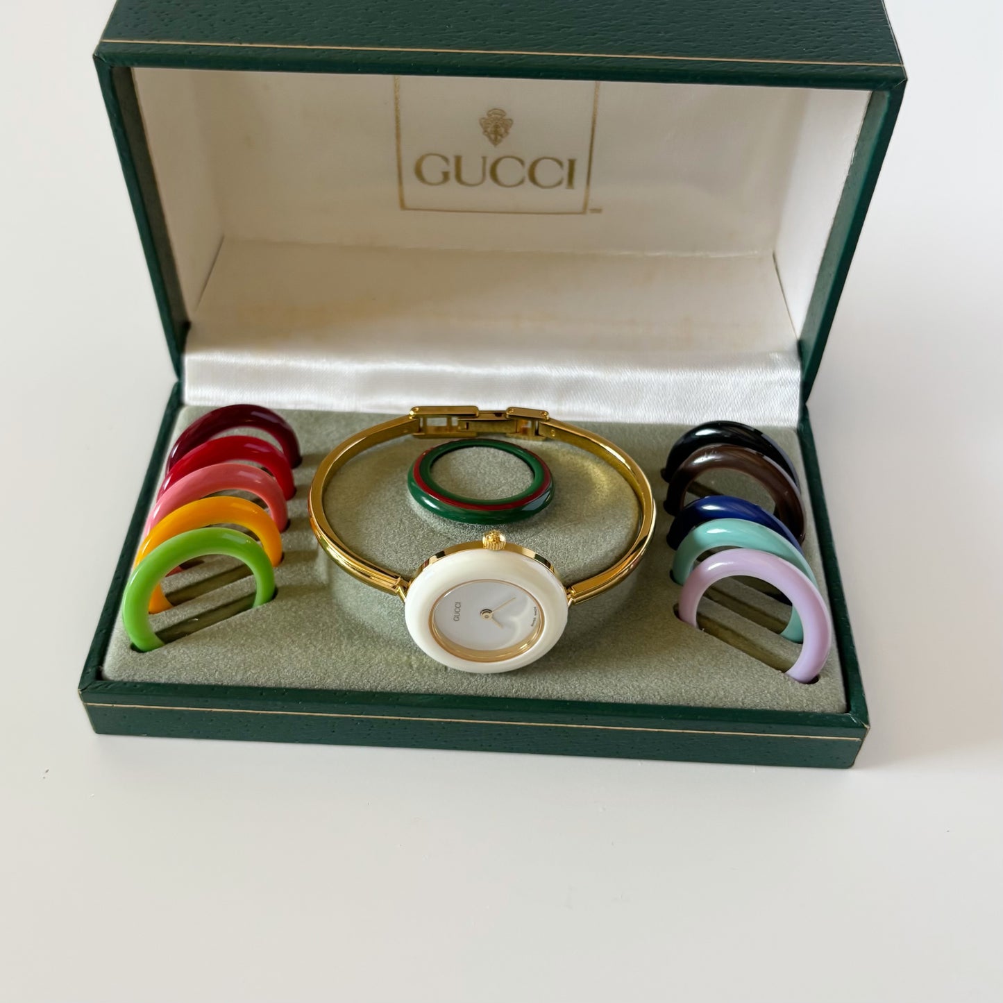 Gucci 1990s Interchangeable Bezel Gold Plated Bangle Watch with case, 12 bezels (Small)