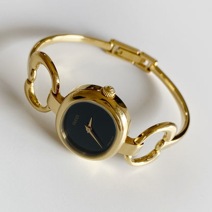 Gucci 1990s Black Dial Gold Plated Bangle Watch