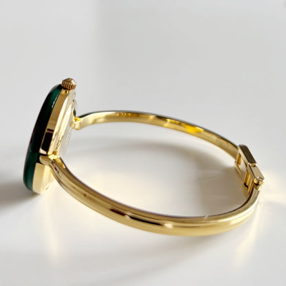 Gucci 1990s Interchangeable Bezel Gold Plated Bangle Watch with 12 bezels, case