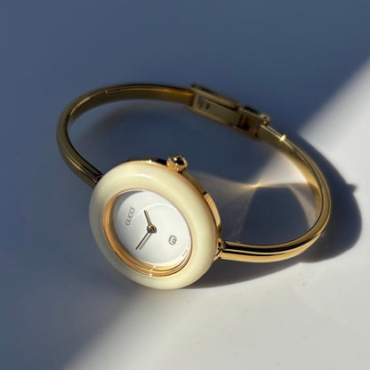 Gucci 1990s Interchangeable Bezel Gold Plated Bangle Watch with 12 bezels, case