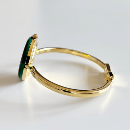 Gucci 1990s Interchangeable Bezel Gold Plated Bangle Watch with 12 bezels, case
