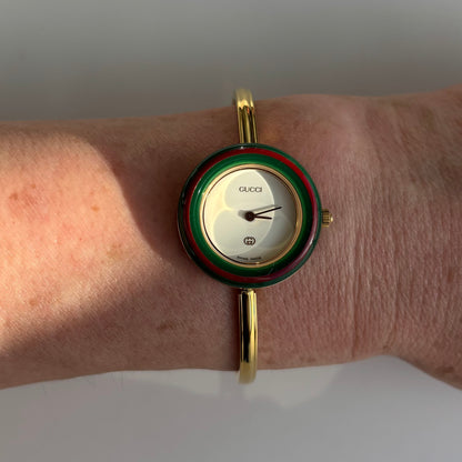 Gucci 1990s Interchangeable Bezel Gold Plated Bangle Watch with 12 bezels, case