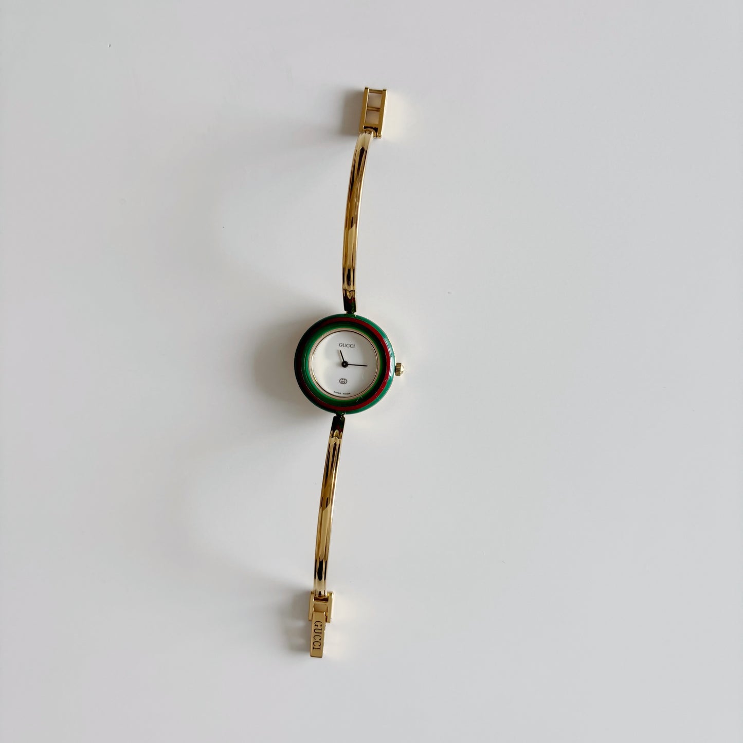 Gucci 1990s Interchangeable Bezel Gold Plated Bangle Watch with 12 bezels, case