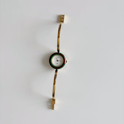 Gucci 1990s Interchangeable Bezel Gold Plated Bangle Watch with 12 bezels, case