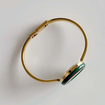 Gucci 1990s Interchangeable Bezel Gold Plated Bangle Watch with 12 bezels, case