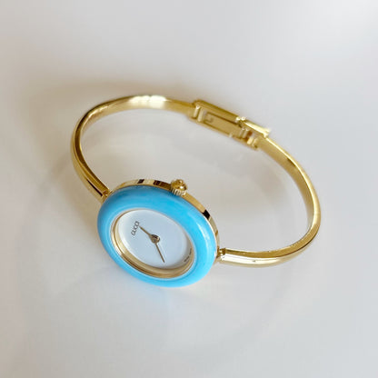 Gucci 1990s Interchangeable Bezel Gold Plated Bangle Watch with 12 bezels, case