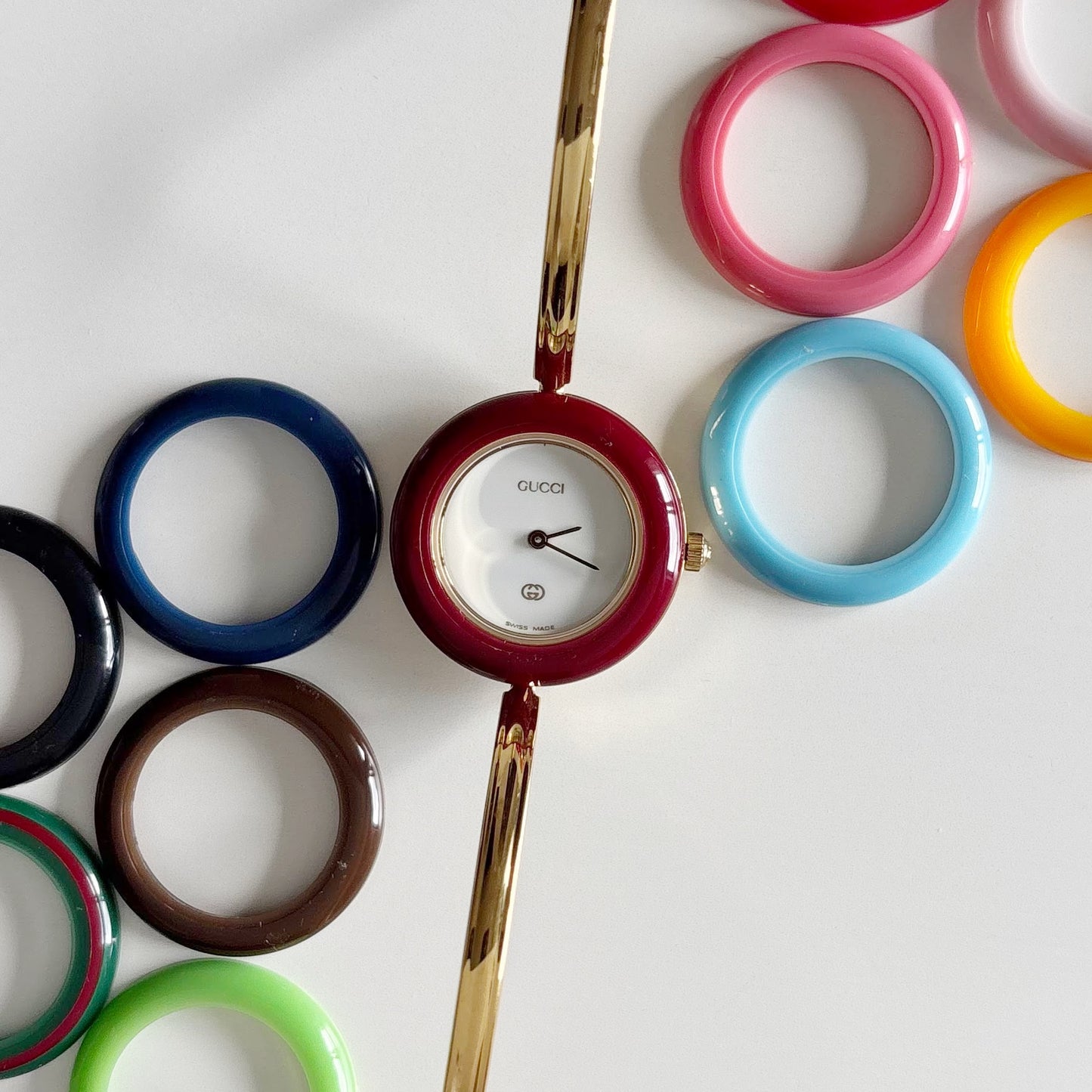 Gucci 1990s Interchangeable Bezel Gold Plated Bangle Watch with 12 bezels, case