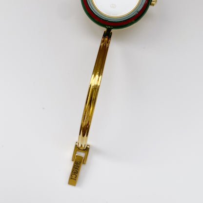 Gucci 1990s Interchangeable Bezel Gold Plated Bangle Watch with 12 bezels, case