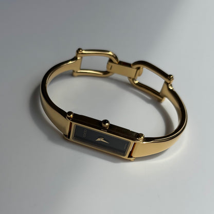 Gucci 1990s Black Rectangular Dial Gold Plated Bangle Watch