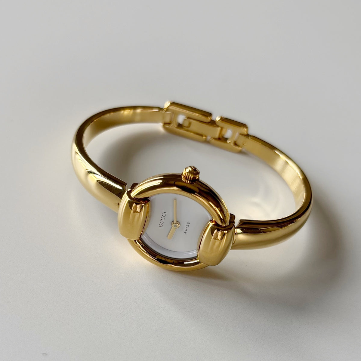 Gucci Round Dial Gold-Plated Bangle Watch