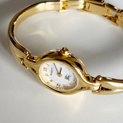 Burberry 1990s Round Dial Gold Plated Bangle Watch