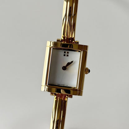 Yves Saint Laurent 1990s Seashell Dial Gold Plated Bangle Watch