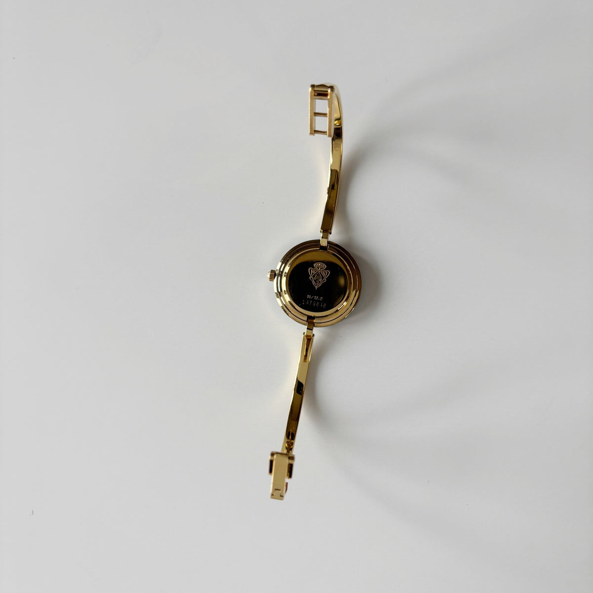 Gucci 1990s Interchangeable Bezel Gold Plated Bangle Watch with 12 bezels, case