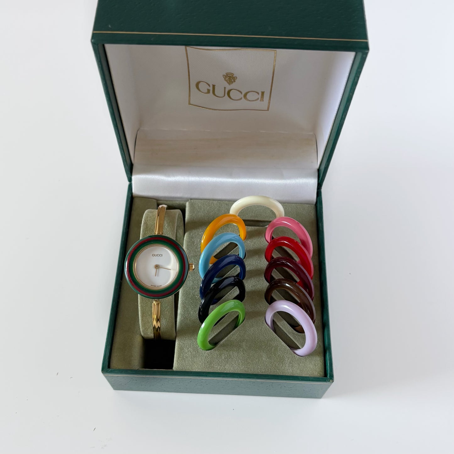 Gucci 1990s Interchangeable Bezel Gold Plated Bangle Watch with 12 bezels, case