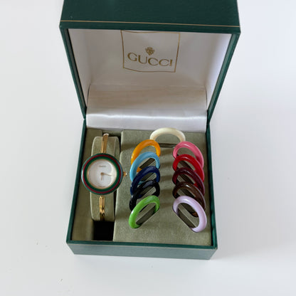 Gucci 1990s Interchangeable Bezel Gold Plated Bangle Watch with 12 bezels, case