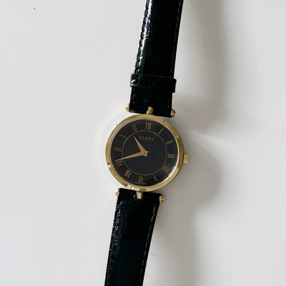 Gucci 1990s Black Dial Gold Plated Black Leather Watch