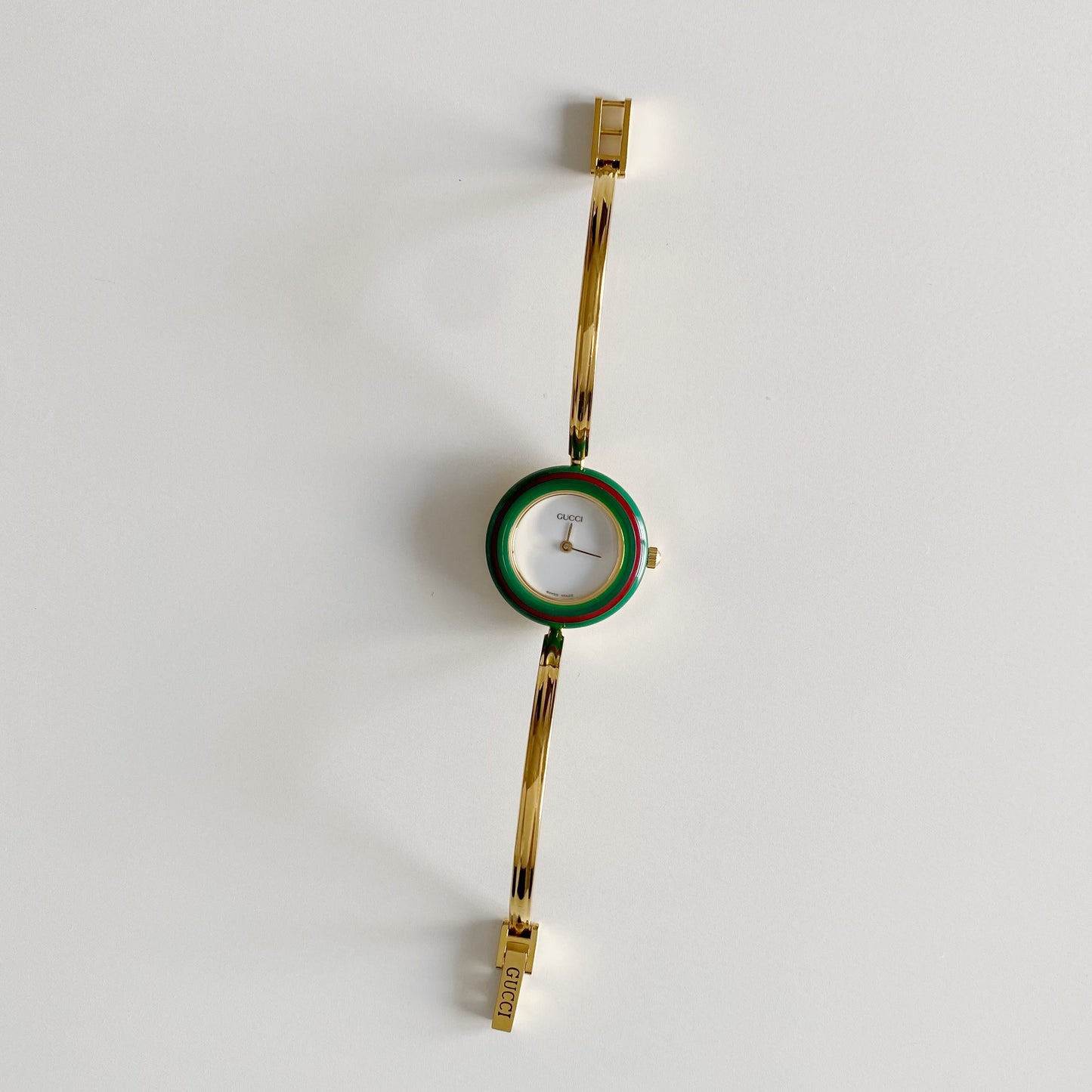 Gucci 1990s Interchangeable Bezel Gold Plated Bangle Watch with 12 bezels, case