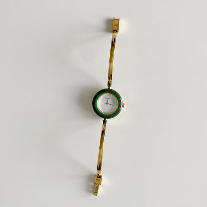 Gucci 1990s Interchangeable Bezel Gold Plated Bangle Watch with 12 bezels, case