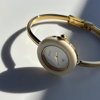 Gucci 1980s Interchangeable Bezel Gold Plated Bangle Watch with 12 bezels, case
