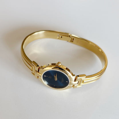 Givenchy 1990s Navy Round Dial Gold Plated Bangle Watch