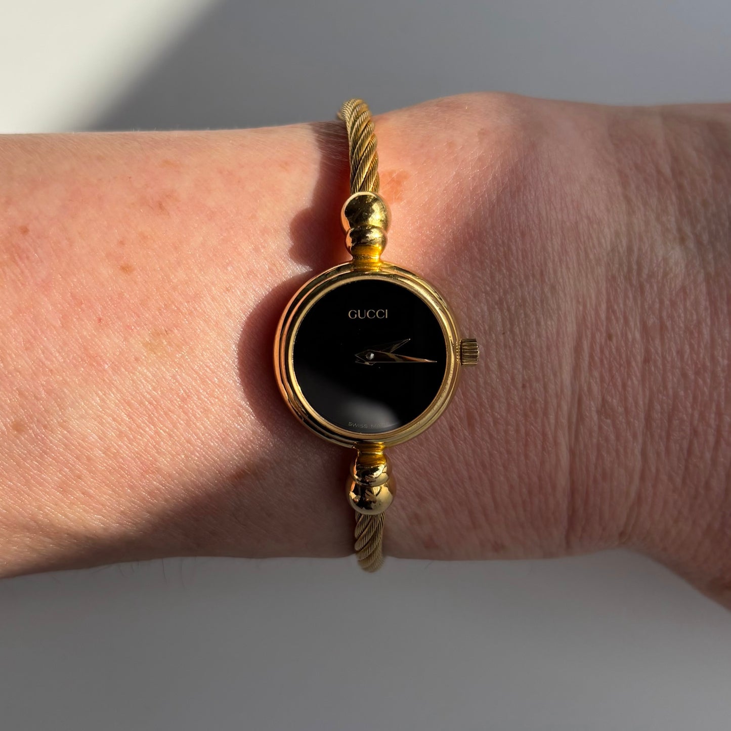 Gucci 1990s Black Dial Gold Plated Cable Bangle Watch