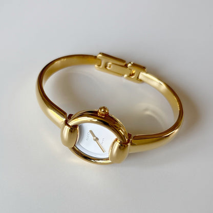 Gucci 1990s Round Dial Gold Plated Bangle Watch