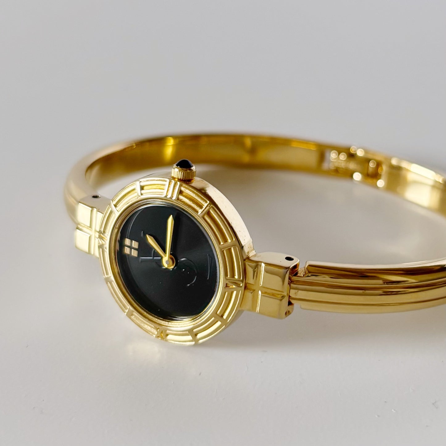 Yves Saint Laurent 1990s Black Round Dial Gold Plated Bangle Watch