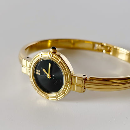 Yves Saint Laurent 1990s Black Round Dial Gold Plated Bangle Watch