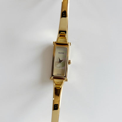 Gucci 1990s Seashell Rectangular Dial Gold Plated Bangle Watch