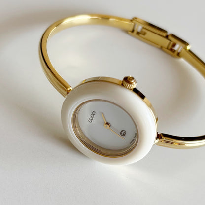 Gucci 1990s Interchangeable Bezel Gold Plated Bangle Watch with 12 bezels, case
