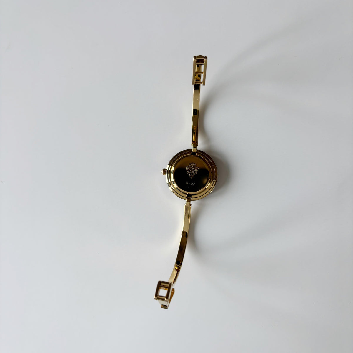 Gucci 1990s Interchangeable Bezel Gold Plated Bangle Watch with 12 bezels, case