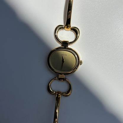 Gucci 1990s Oval Dial Gold Plated Bangle Watch