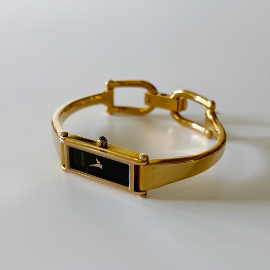 Gucci 1990s Rectangular Black Dial Gold Plated Bangle Watch