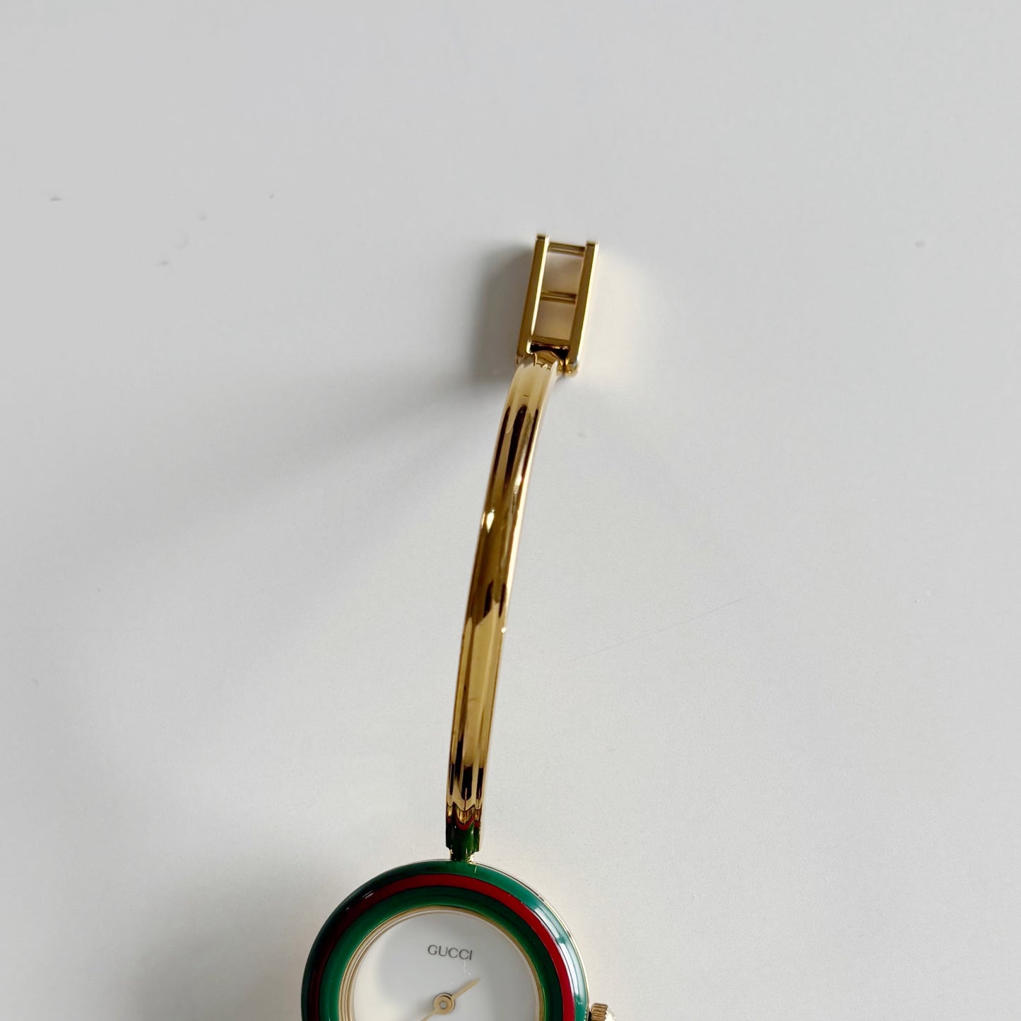 Gucci 1990s Interchangeable Bezel Gold Plated Bangle Watch with 12 bezels, case