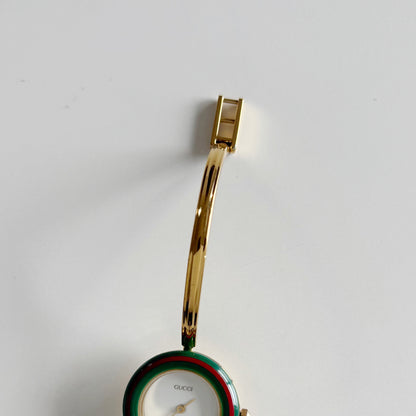 Gucci 1990s Interchangeable Bezel Gold Plated Bangle Watch with 12 bezels, case