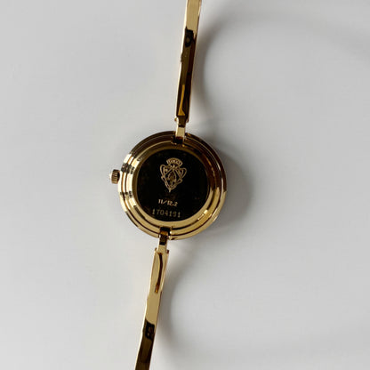 Gucci 1990s Interchangeable Bezel Gold Plated Bangle Watch with 12 bezels, case