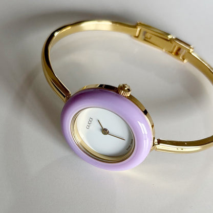 Gucci 1990s Interchangeable Bezel Gold Plated Bangle Watch with 12 bezels, case